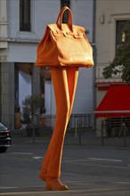 The bronze sculpture Walking Bag by Erwin Wurms at the entrance of the urban shopping zone, Bonn,