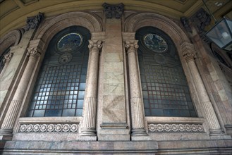 Window of the Palazzo della Borsa, built between 1907 and 1912, in Piazza de Ferrari, Genoa, Italy,