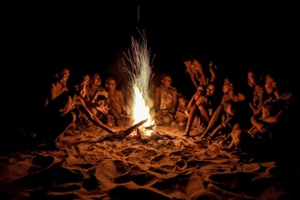 Bushmen of the Ju/' Hoansi-San sitting at the campfire, village //Xa/oba, near Tsumkwe,