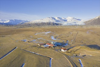 Aerial view over farm at Haukafell near Falljökull in winter, one of many outlet glaciers of