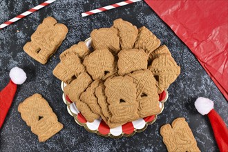 Speculaas or speculoos, a spiced thin, crunchy and caramelized and shortcrust biscuit with figure