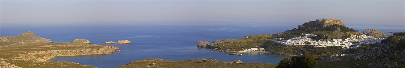 Panorama shot, evening light or late afternoon light, Acropolis and St John's Fortress of Lindos,