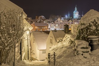 Snow-covered wooden buildings, night scene, historic town centre, Stavanger, Rogaland, Norway,