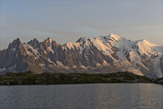 At the mountain lake Lac Blanc, evening light on the Mont Blanc massif with Mont Blanc covered with