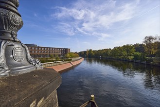 Spree with Magnus-Hirschfeld-Ufer from the Luther Bridge with historical lamppost in Berlin,