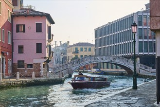 View from 'Fondamenta del pagan' to 'Ponte de la cereria' an the waterway in Venice on a sunny day