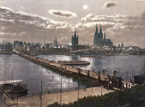 Cologne, Germany, 1890-1905, view of the city by moonlight across the Rhine with the cathedral on