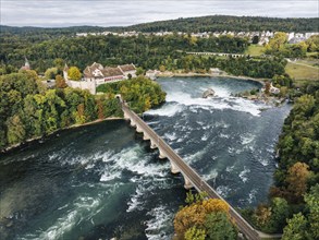 Aerial view of the Rhine Falls with railway viaduct and Laufen Castle in autumn, Neuhausen, Canton