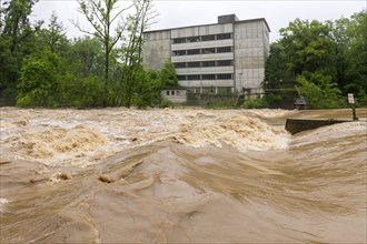 Symbolic image extreme weather, global warming, climate change, flood, flooded weir in Remseck an