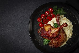 Fried duck shank, cauliflower puree, cherry tomatoes, homemade, no people