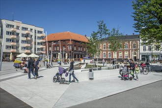 People on the square in the modern center of Swinoujscie, Western Pomerania, Poland, Eastern