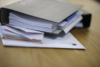 Symbolic photo on the subject of files. File folders lie on a table. Berlin, 13.08.2024