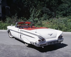 White with chrome and red trim 1958 Chevrolet Impala convertible classic automobile, Quebec,