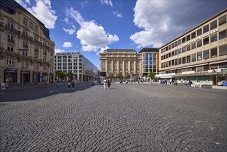 White and grey cumulus clouds with blue sky over Rathenauplatz in Frankfurt am Main, district-free