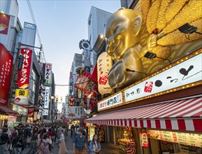 Night-time street with neon lights and illuminated signboards, Dotonbori district, Osaka, Japan,