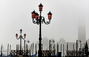 View of San Giorgio Maggiore from the cloudy Piazza San Marco with its old lanterns, 19.10.2008,