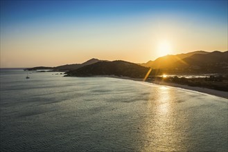 Beach and mountains, sunset, Spiaggia di Sa Colonia, Torre di Chia, Chia, south coast, Sardinia,