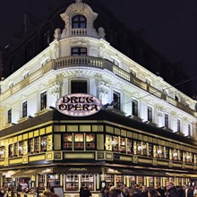 Illuminated exterior façade of the Drug Opera restaurant at night, Brussels, Belgium, Europe