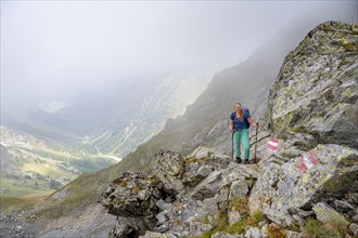 Hiker in the fog, Alpine dangers, Carnic Main Ridge, Carnic High Trail, Carnic Alps, Carinthia,