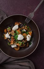 Warm Salad with crispy eggplant and tomatoes, cottage cheese, spices, herbs, sesame seeds,