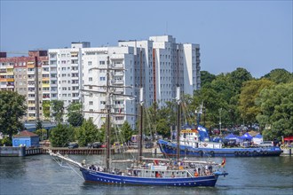 The three-masted schooner Santa Barbara Anna sails on the river Swina in Swinoujscie, Western