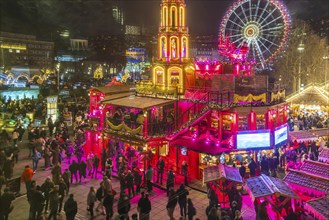 Stuttgart Christmas market at the blue hour. Christmas pyramid on Schlossplatz in front of the New