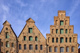 Historic salt warehouse, brick building, gable against blue sky with veil clouds, Hanseatic city of