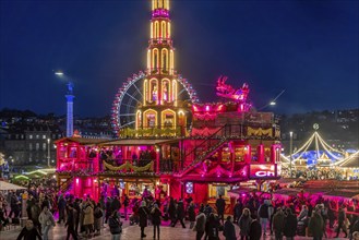 Stuttgart Christmas market at the blue hour. Christmas pyramid on Schlossplatz in front of the New