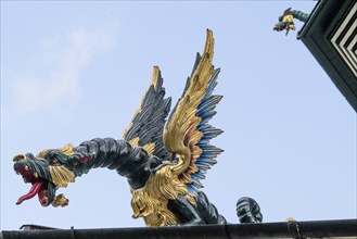 Close-up of a gold-blue-red painted dragon statue, historic large pagoda, Royal Botanic Gardens