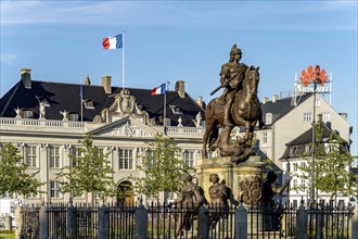 Equestrian statue of King Christian V and Thott's Palace on Kongens Nytorv square, Copenhagen,