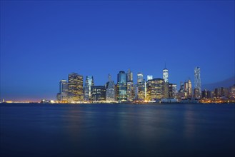 Skyscrapers on the waterfront, night shot, Manhattan, New York City, New York, USA, North America