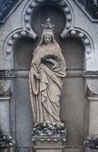 Sculpture depicting the Virgin Mary reading a book, tombstone in a cemetery, France, Europe