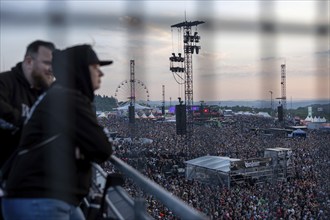 Adenau, Germany, 7 June 2024: Fans on the terrace listen to Queens of the Stone Age at Rock am Ring