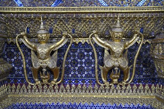 Golden sculptures of Garuda and Naga, Wat Phra Kaew, Temple of the Emerald Buddha, Bangkok,