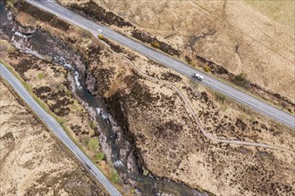 Top down view of road, path and river in the Glen Coe valley, Scotland, UK