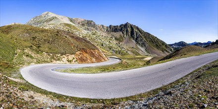 View of road and mountains at border pass Col dela Lonbarde (Colle della Lombarda), Italy and