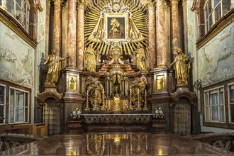 Altar of the baroque parish church Mariahilfer Kirche in Vienna, Austria, Europe