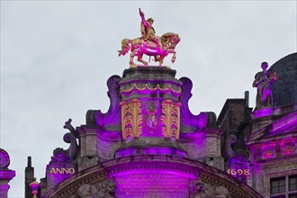 The illuminated golden horseman Charles de Lorraine on the guildhall L'Arbre d'Or, Guild of