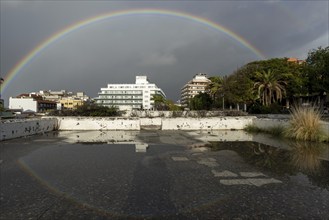 Rainbow over the Plaza de la Derrhumbada, former bus station, closed since 2009 due to