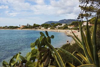 Seaside village with sandy beach, Spiaggia di Su Guventeddu, Pula, south coast, Sardinia, Italy,