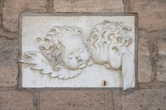 Relief of angel heads on the town wall of the kindergarten, Allersberg, Middle Franconia, Bavaria,