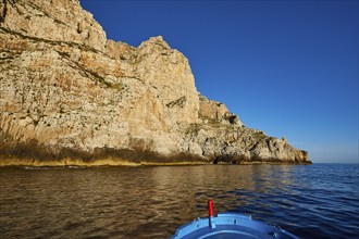 Evening light, boat tour, boat bow, view from the sea, bizarre rock formations, rugged mountains,