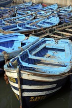 Traditional blue fishing boats in the harbour of Essaouira on the Moroccan Atlantic coast, Morocco,