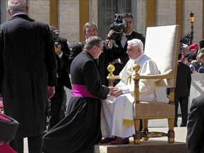 Pope Benedict XVI Joseph Ratzinger welcomes a bishop to the 1st audience on 27. 04. 2005, St.