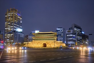 Seoul, South Korea, April 1, 2016 : Namdaemun Gate Sungnyemun at night with city traffic, Seoul,