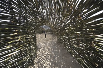 Sandworm by artist Marco Casagrande in the dunes during Beaufort04 at De Haan, Wenduine, Belgium,