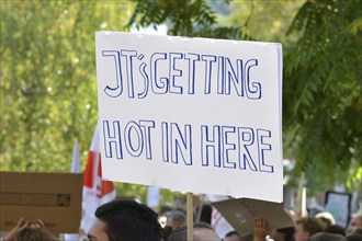 Heidelberg, Germany, September 2019: Protest sign cardboard saying Its getting hot in here during