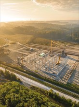 Aerial view during the construction of the Lindenrain industrial park with fog at sunrise Black