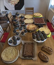 Cake buffet on a dining table, Lower Saxony, Germany, Europe