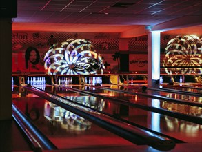 Colourfully illuminated bowling alley, bowling centre, interior, Germany, Europe